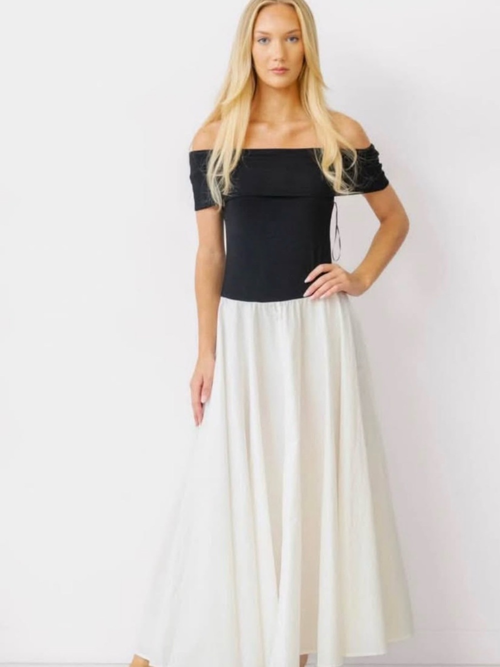 Off-Shoulder Black Top with Flowing White Maxi Skirt